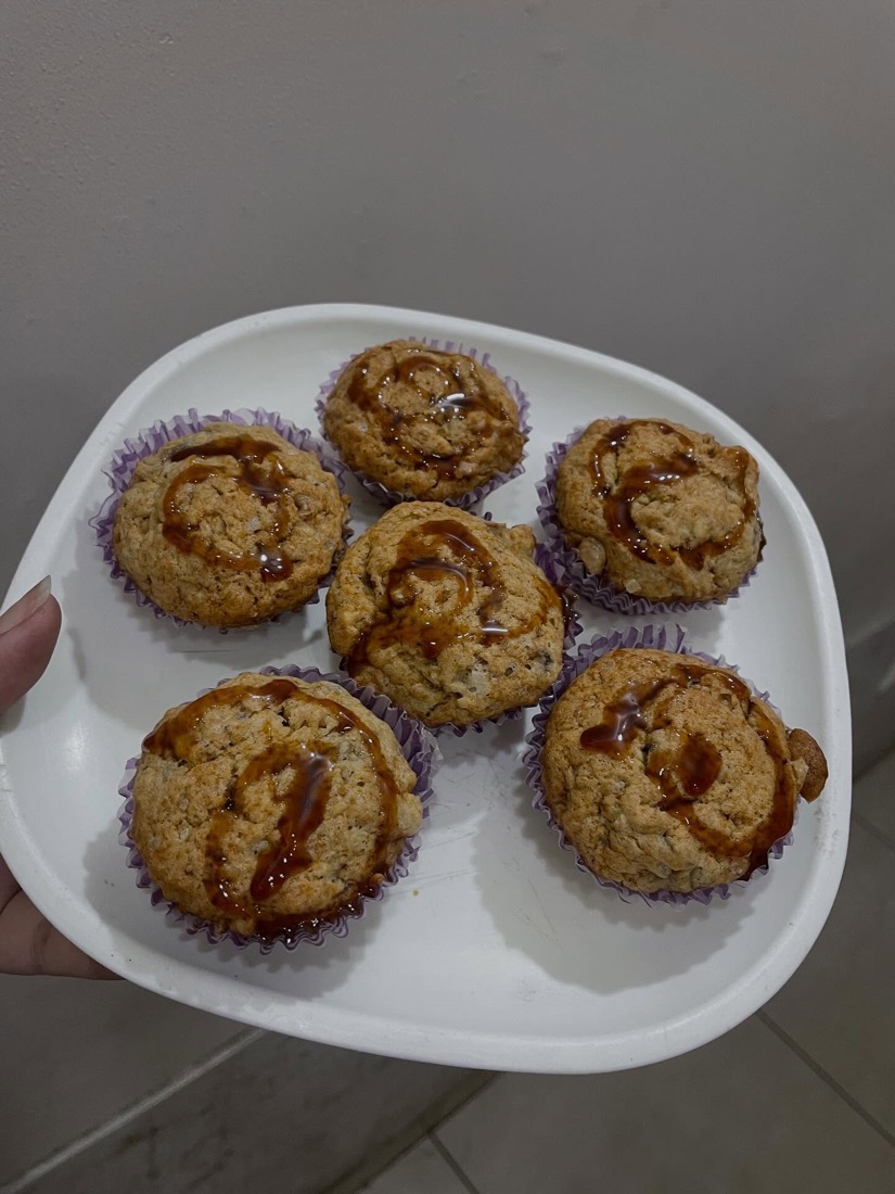 A plate of muffins drizzled with honey