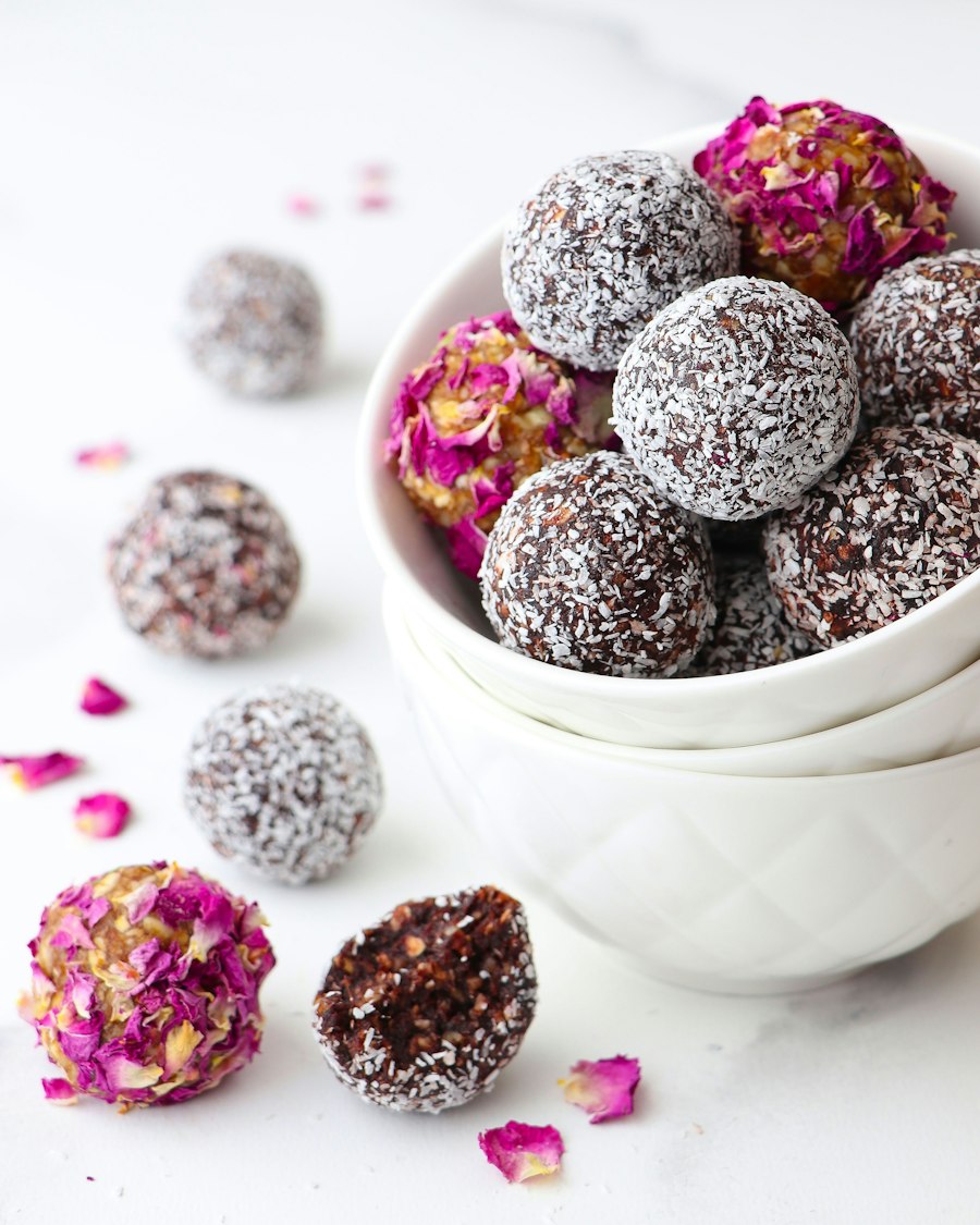 A bowl of cocoa and coconut truffles